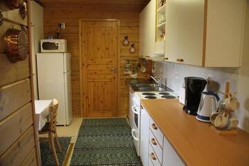Фото номера Коттедж с 1 спальней Дома для отпуска Puolukkamaan Pirtit Cottages г. Lampsijärvi 17