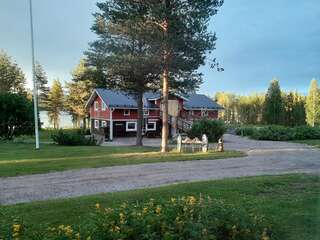 Фото Дома для отпуска Puolukkamaan Pirtit Cottages г. Lampsijärvi